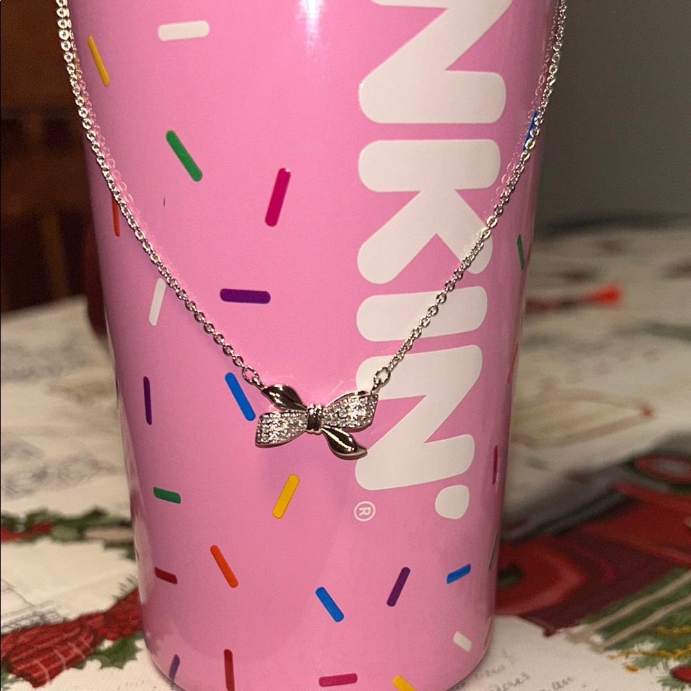Chic Reversible Silver Bow Necklace with Cubic Zirconia Accent stones.